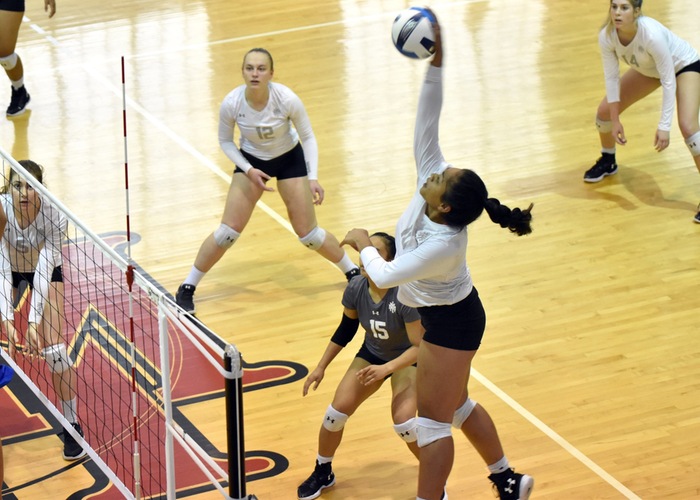 NMMI freshman opposite-side hitter Gabriela Langi with the kill attempt against Western Texas College. Langi led the Broncos in hitting percentage (.290) and had 12 kills in the three-set home win: 25-17, 29-27, 26-24.. Photo courtesy of cadet Karim Gunter.