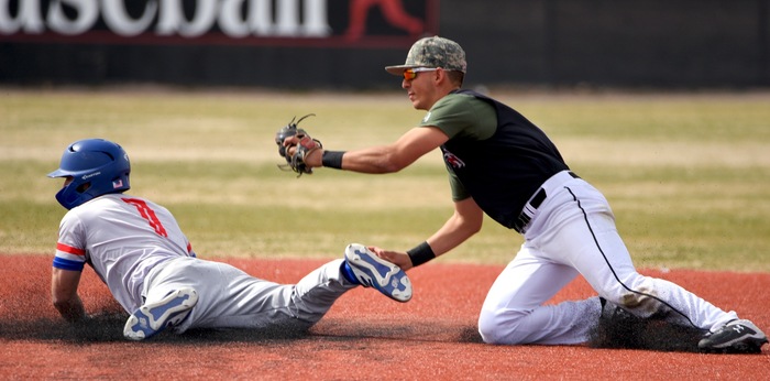 NCTC's Clay Stevens slides safely into second for a stolen base in Game 3 before NMMI shortstop Rudy Solis can apply the tag. (Photo courtesy of Shutternut)