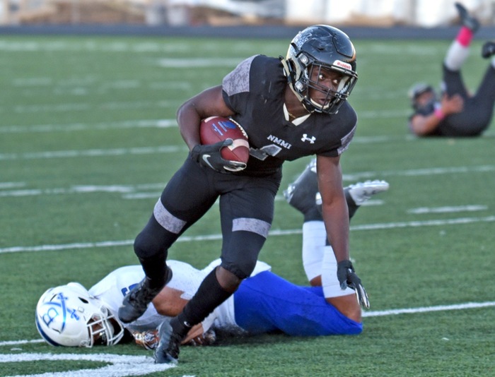 NMMI sophomore running back gets by a Blinn defender after a pass reception in the third quarter. Photo by Shutternut.