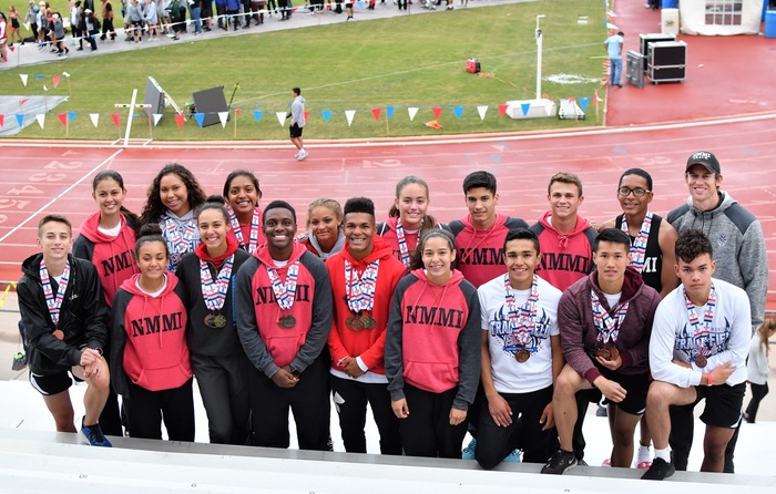 The members of the Colt & Lady Colt track and field team, along with assistant coach Connor Williamson, pose for a pic during a brief weather delay at the tail-end of Saturday's meet.